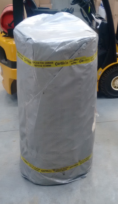 Pool cover wrapped in packaging